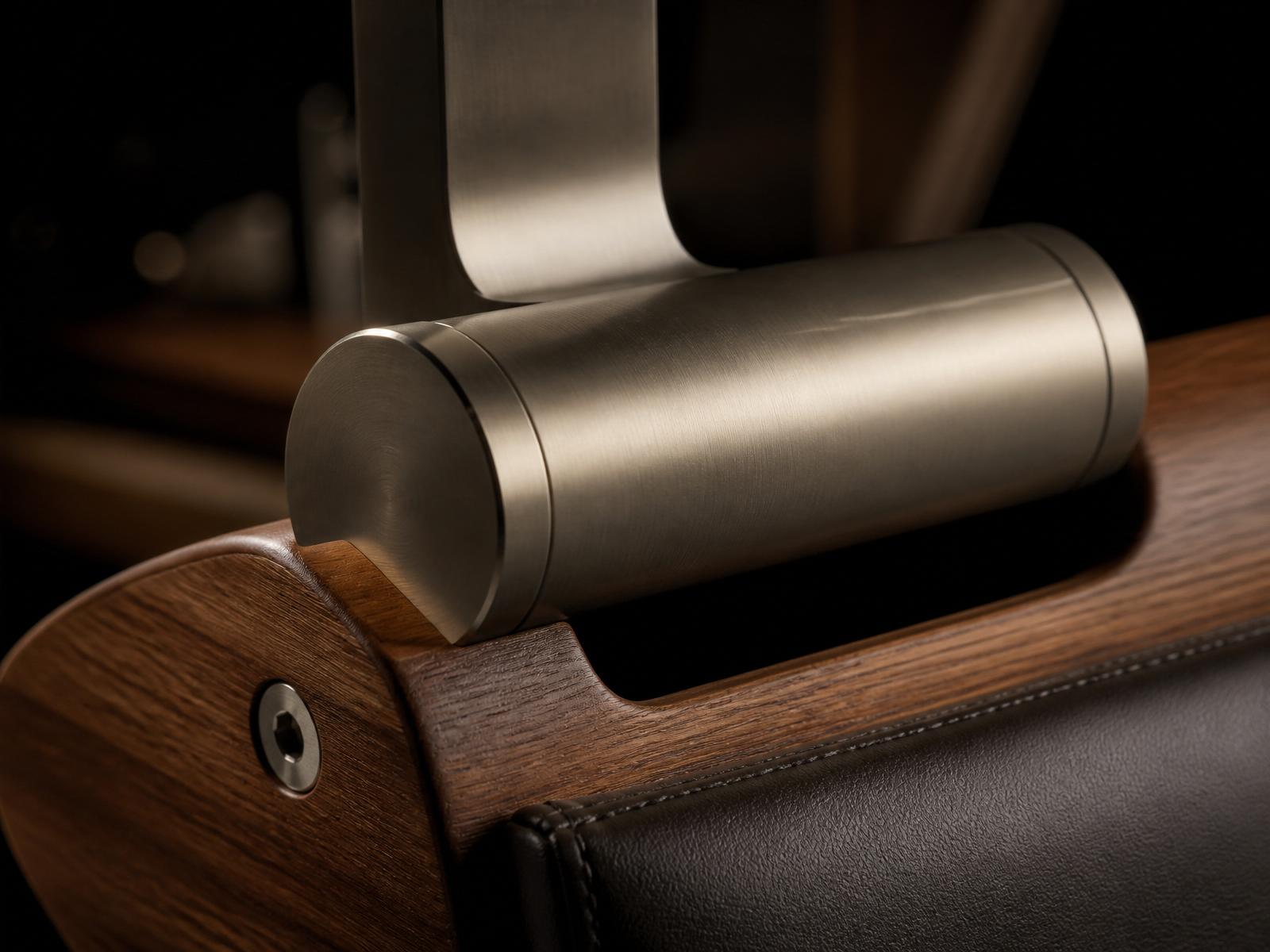 Detail of brushed metal and wood joinery on premium equipment